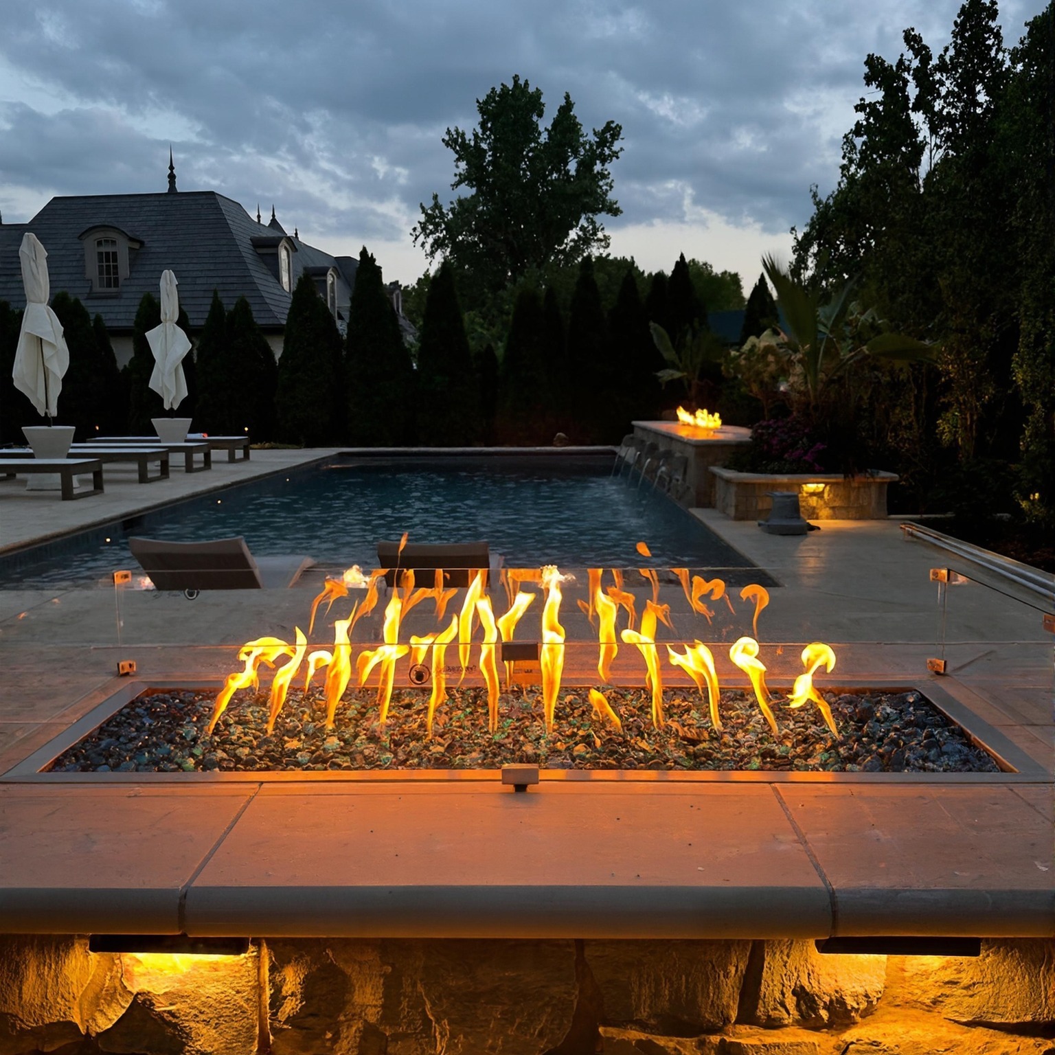 Luxury pool with fire pit and water features in Columbus Ohio